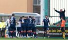 The Raith Rovers players celebrate their equaliser versus Hibs. Image: SNS.