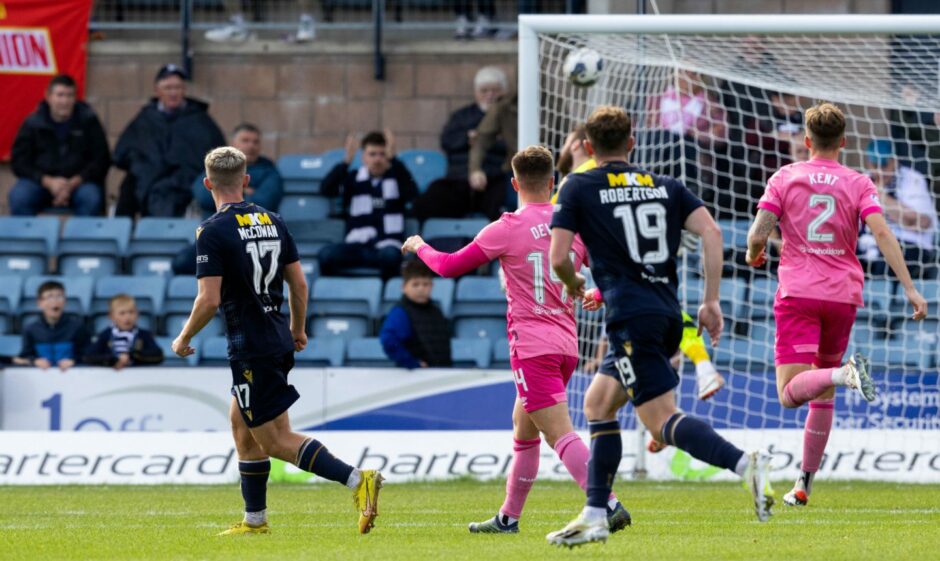 McCowan sees his long-range lob find the top corner against Hearts in August. 