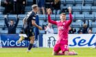 Luke McCowan celebrates his winner against Hearts. Image: SNS