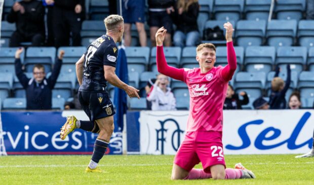 Luke McCowan celebrates his winner against Hearts. Image: SNS