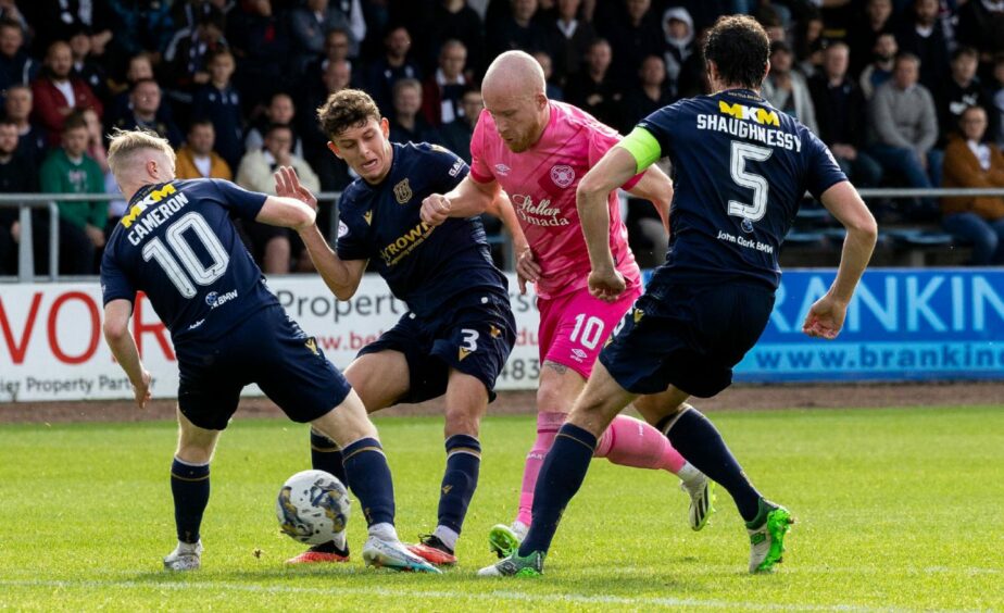 Dundee team up to deny Liam Boyce. Image: SNS
