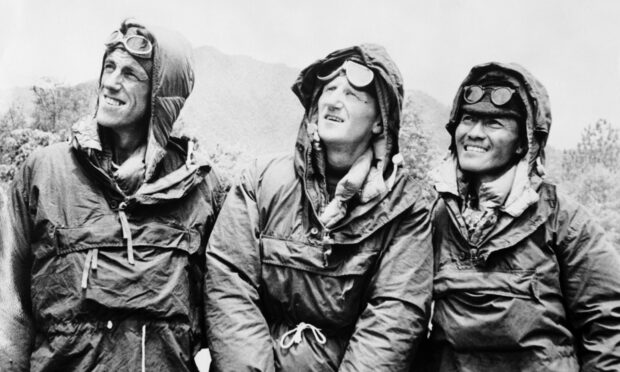 The first conquerors of Everest, Edmund Hillary, left, and Sherpa Tensing Norgay, right, with expedition leader Colonel John Hunt, in Kathmandu, Nepal, after descending from the peak in 1953.