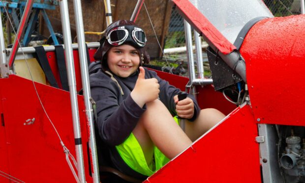 Kai McDermott,10, takes a seat in the centre's Red Baron replica. Image: Paul Reid