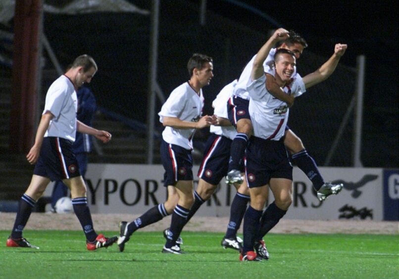 Dundee players celebrate with Gavin Rae against Vllaznia. Image: DCT