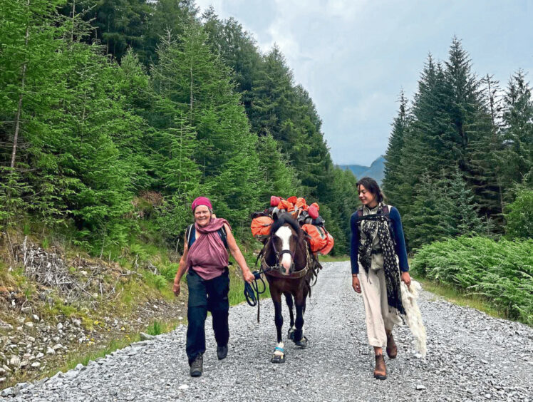 Sue leading her Welsh pony Kirsty with her friend Jessica during the charity trek. 