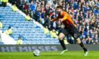 Nadir Ciftci celebrates scoring for Dundee United against Rangers before scoring