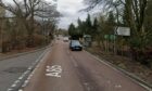 A car and a van have collided near Almondbank, Perthshire.