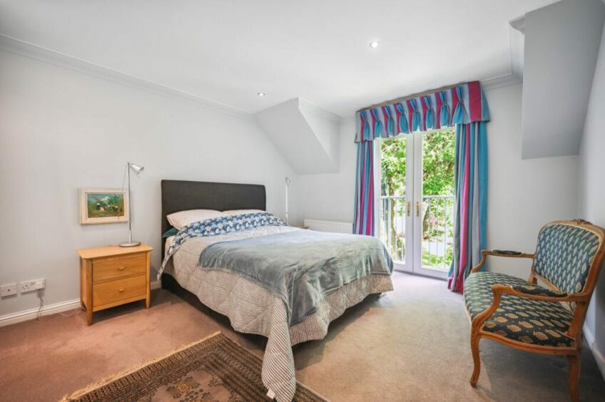 Master bedroom with Juliet Balcony at colourful Perthshire home with annexe 