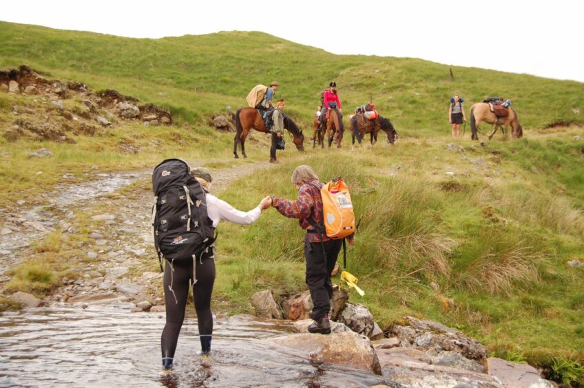 Riders and their horses from the Big Hoof charity trek out in the wilderness. 