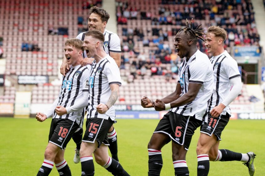 Ewan Otoo and the other Dunfermline players celebrate Paul Allan's winning goal.