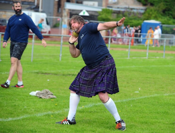 Shot putter gives it his all at the Inverkeithing Highland Games. 