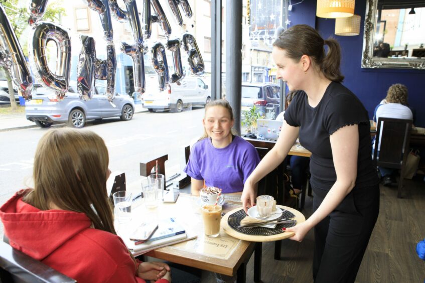 Hannah Campbell serves customers at Blend Coffee Lounge in Perth