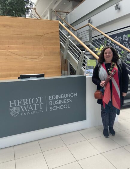 Mhairi poses at the Heriot-Watt University in Edinburgh where she graduated from the Help to Grow programme