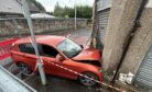 BMW remains imbedded in the former Gina's Chip Shop building in Cowdenbeath after the crash.