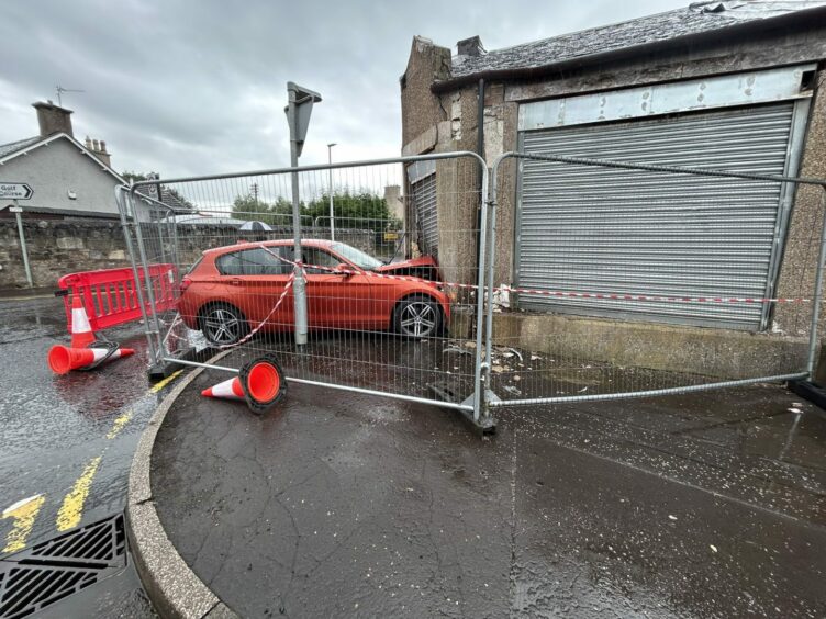 The building and the vehicle have been fenced off amid fears the building is now unsafe.