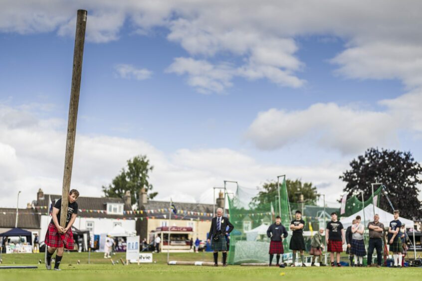 Tossing the caber at Crieff Highland Games 2022.