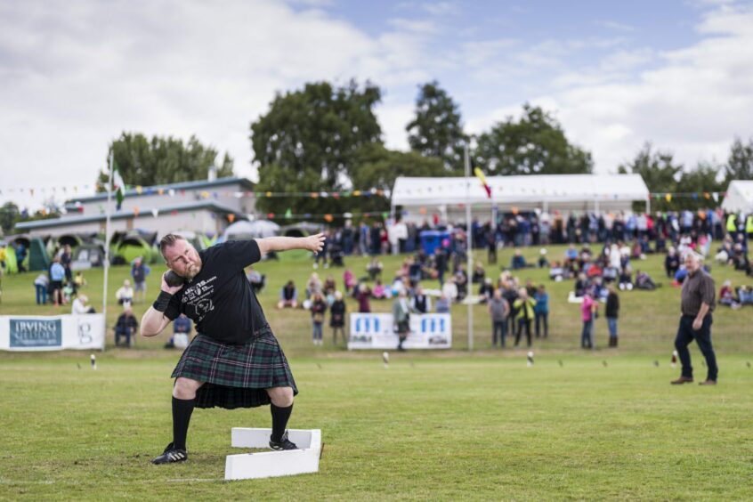 Man in kilt taking part in highland games in Crieff