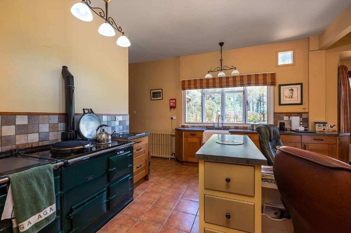 The kitchen features an Aga oven