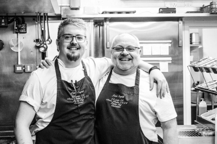 A black and white image of two chefs in the kitchen at Jack 'O' Bryan's.