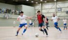 PYF Saltires (navy) had a perfect record in the Scottish Super League last season, pictured is a clash with Dundee at DISC. Image: Scottish Futsal.