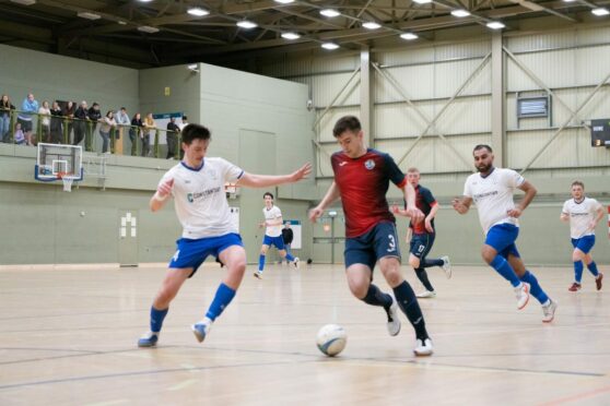 PYF Saltires (navy) had a perfect record in the Scottish Super League last season, pictured is a clash with Dundee at DISC. Image: Scottish Futsal.