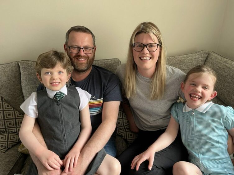 Fife girl Erin Marshall ready for her first day in primary one with dad Derek, mum Catrina and sister Neave, who is going into primary four. 