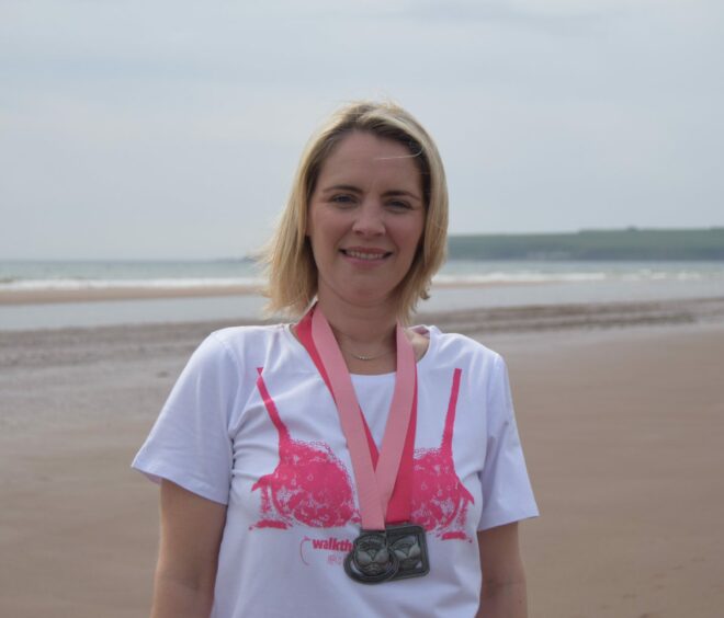 Barbara-Ann Mackay with her MoonWalk medals from 2006 and 2007. 