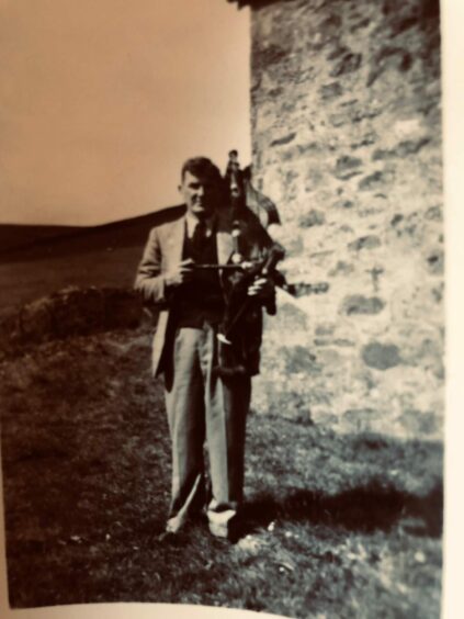 Alexander Ferguson pictured with his bagpipes at Buckhood Cottage in Angus. 