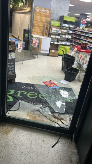Damage caused after a break-in at Greens of Dundee store in Stobswell