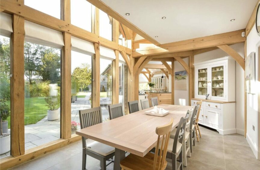 An open-plan dining hall overlooks the garden. 