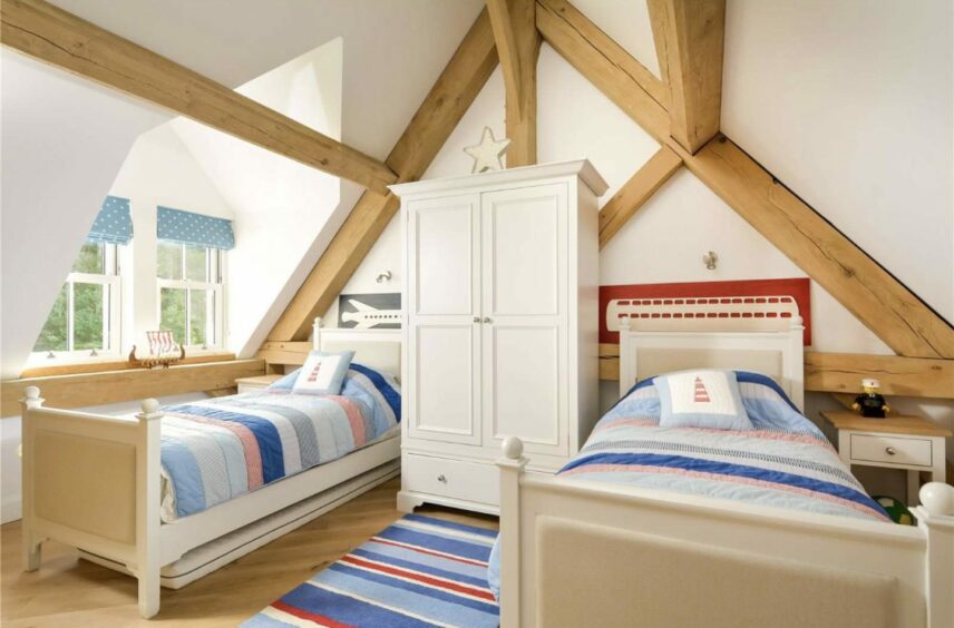 Each bedroom features exposed timber beams.