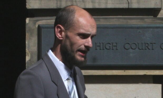 Ian Higgins leaves the High Court in Edinburgh after being cleared.
