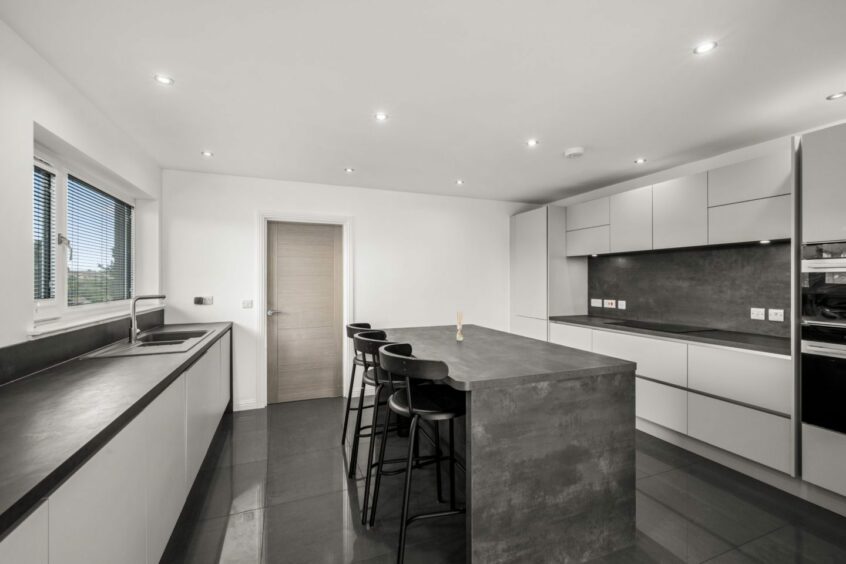 The minimalist kitchen at Broughty Ferry tiered home
