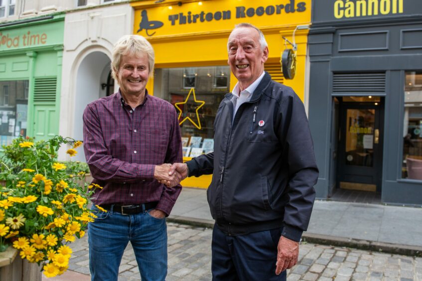 George Robertson shakes hands with new Dundee Record Fair organiser Andrew Kennedy