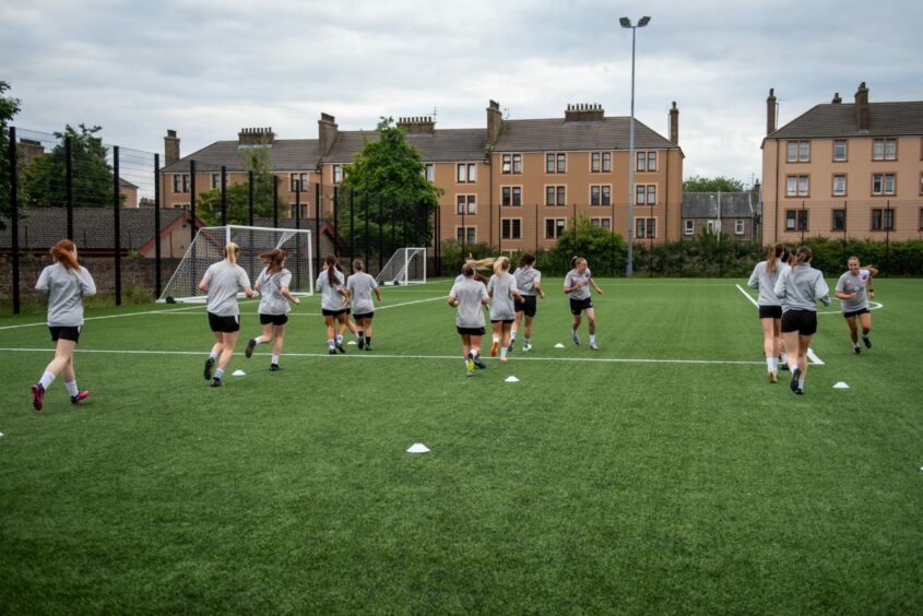 Dundee United women carry out a running drill at Gussie Park Dundee