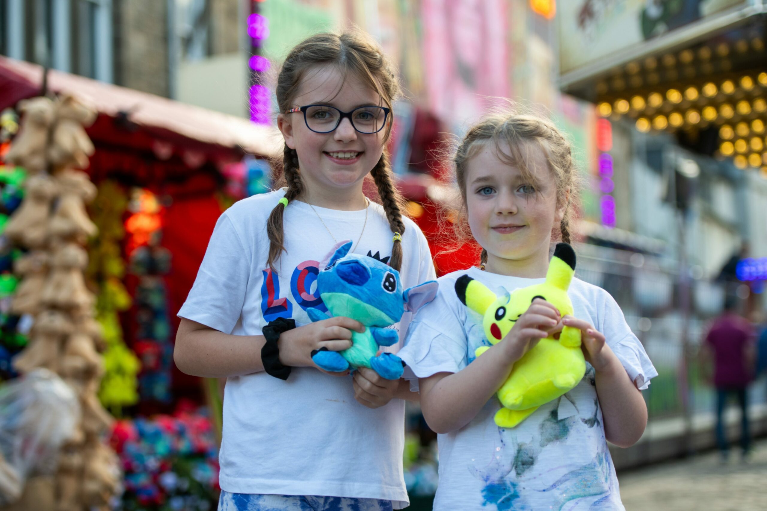 Faith and Riley Macklin won prizes on one of the stalls at the  Lammas Market, Market Street, St Andrews.