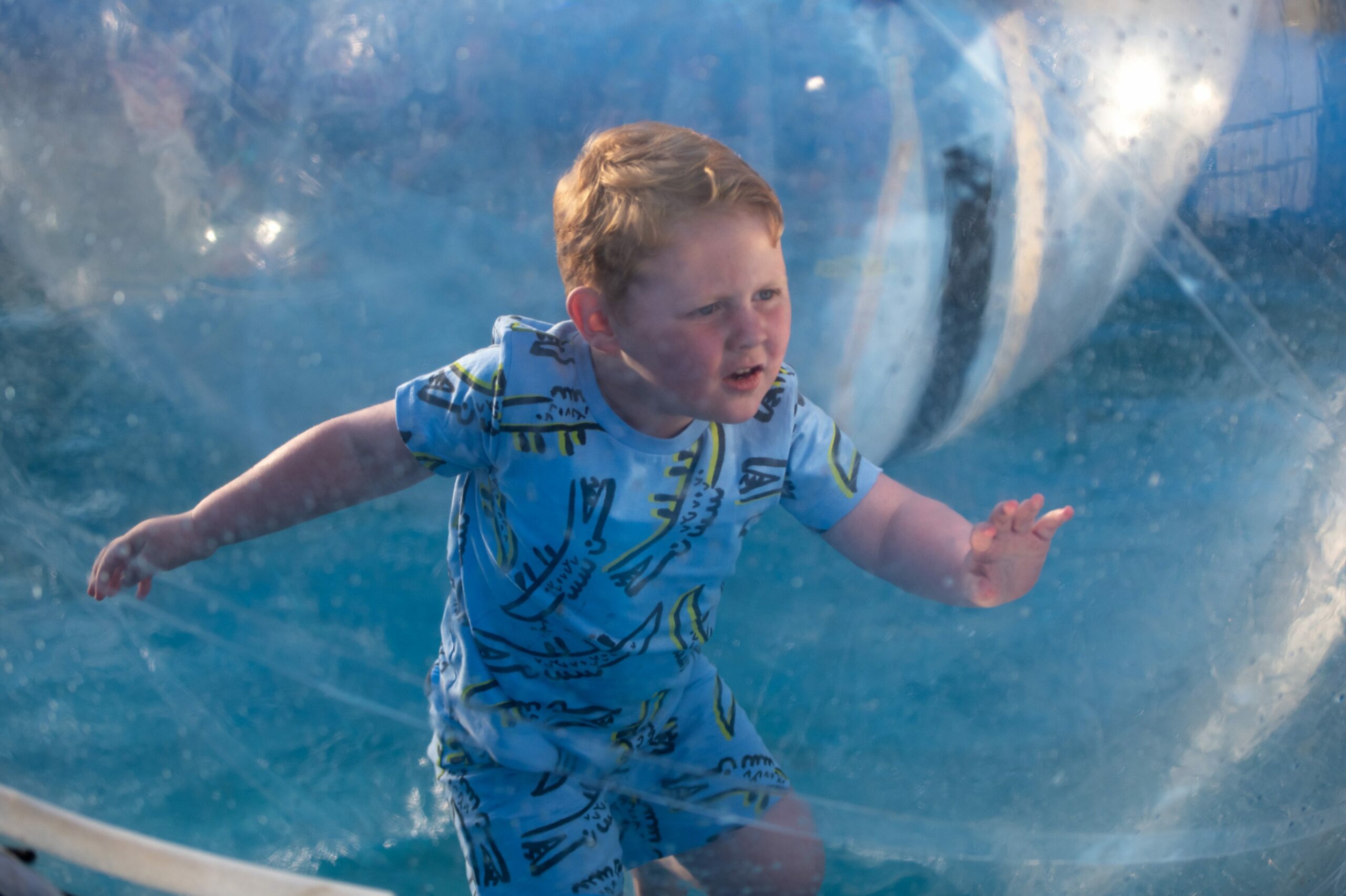 Arlan-Jay Burgess tries the water balloons at the Lammas Market, Market Street, St Andrews.