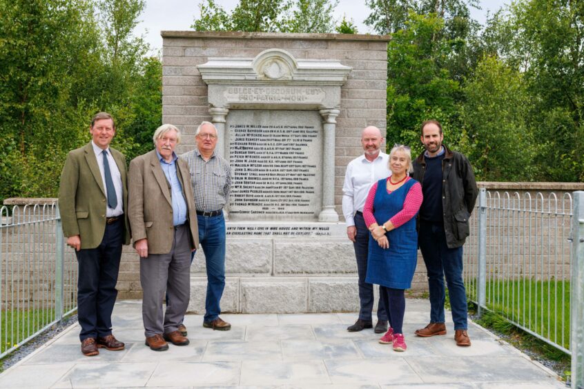 Johnny Stewart, (landowner) Mike Barnacle (Fossoway Development Trust) Councillor Andrew Parrott, Martin McGrath (Profile Projects), Trudy Duffy-Wigman (outgoing chairwoman of Fossoway Community Council) and Councillor Neil Freshwater with the Blairingone war memorial
