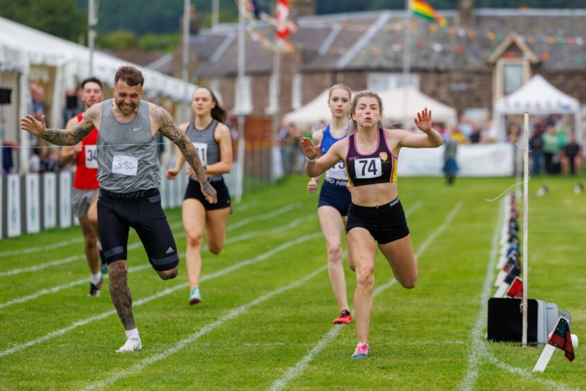 Two runners at the finish line at Crieff Market park.