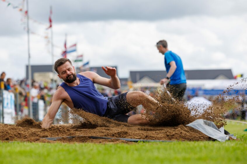 Long jumper hitting the sand at Crieff.