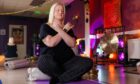 Health and wellbeing features writer Debbie Clarke relaxing as she experiences meditation.