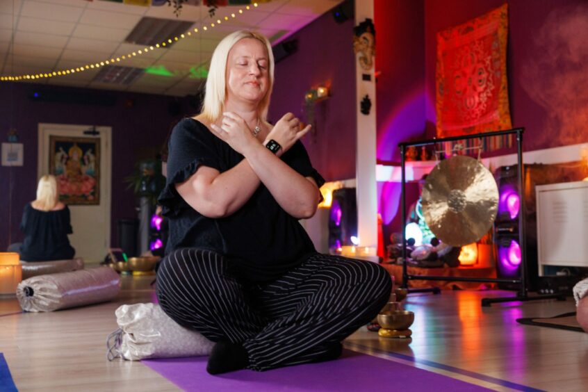 Health and wellbeing features writer Debbie Clarke relaxing as she experiences meditation.