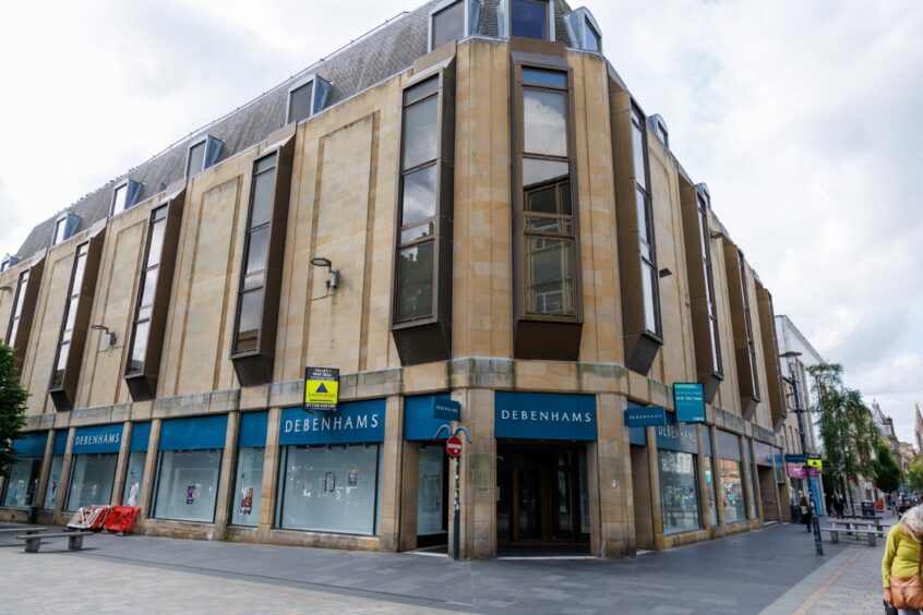 Empty Debenhams store with To Let signs on Perth High Street