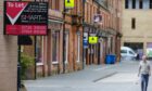 Row of empty properties with To Let signs in Perth city centre