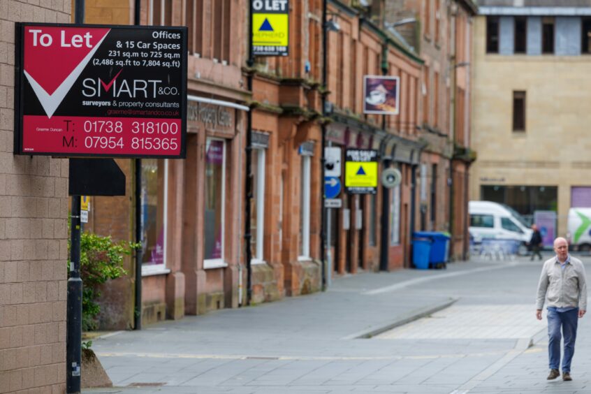 Street in Perth city centre with three To Let signs very close together