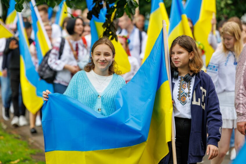 Two young women with Ukraine flag.