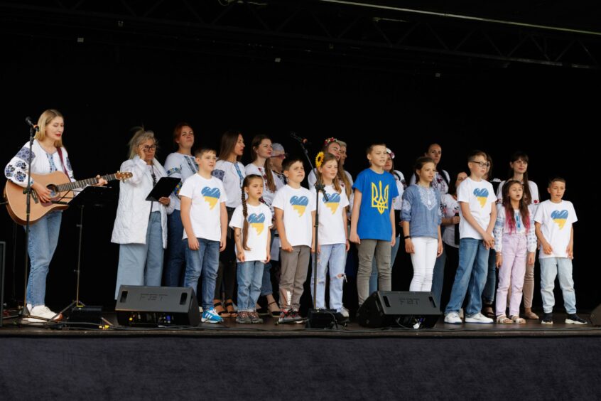 Children of the Dundee Ukranian Choir on stage.