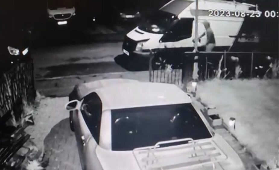 Moments before the blaze CCTV captures an individual trying to gain access to the vehicle.