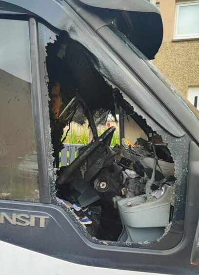 The burnout interior of the van following the blaze which police are treating as deliberate.