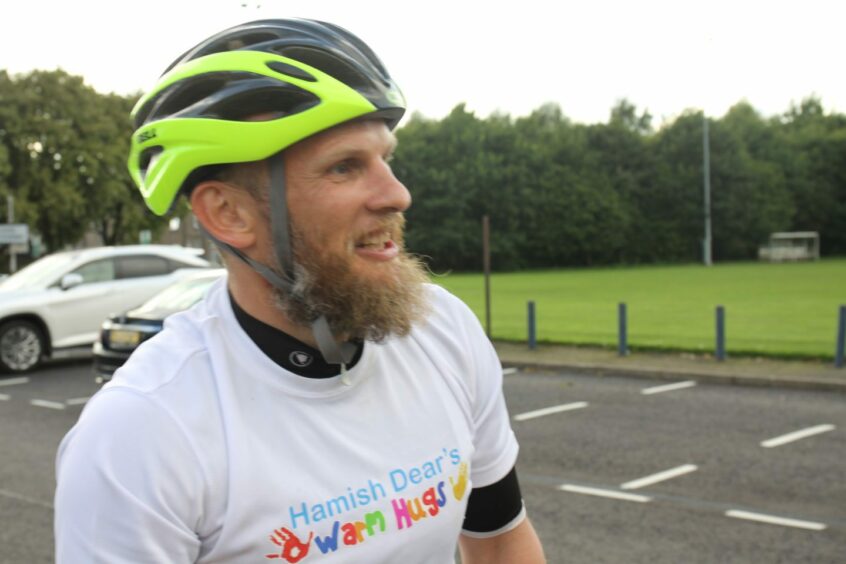Kris Dear taking part in the charity cycle